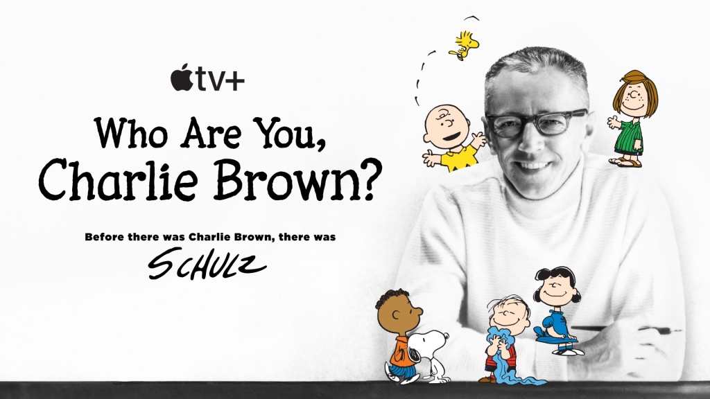Peanuts creator Charles M. Shultz surrounded by his characters, including Charlie Brown and Snoopy